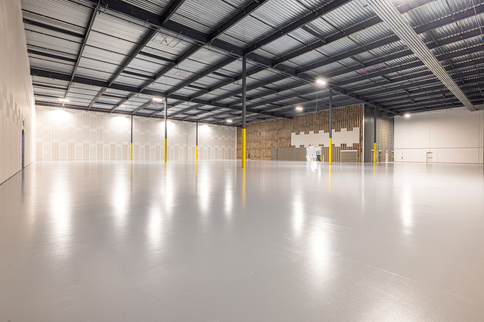 Bright white high-gloss epoxy warehouse floor in Tampa